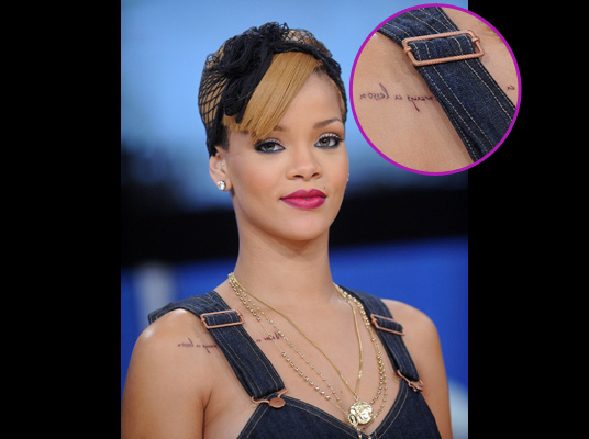 rihanna showed off her 11th new tatto on her chest the tatto is writen 